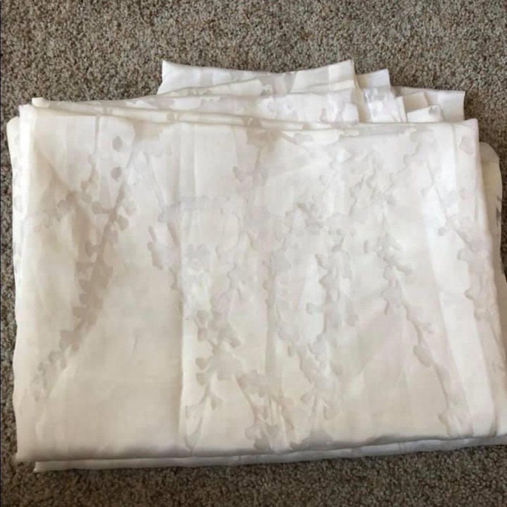 84” L sheer curtains pair with vines